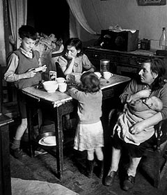 Family eating in their Gorbals flat, Glasgow 1948. 
Credit: Getty Images