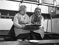 Two ladies reading a paper together. 
Credit: SCRAN 
© The Scotsman Publications Ltd. Licensor